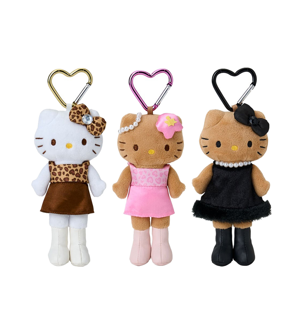Three Hello Kitty keychains in different outfits on a white background