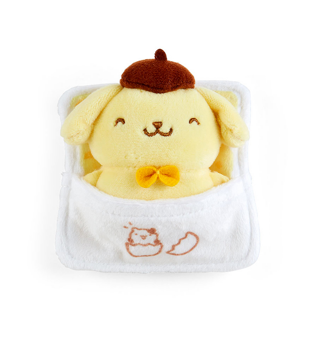 A plush mascot holder featuring the character Pompompurin, sealed in a clear packaging with a yellow and green aesthetic.